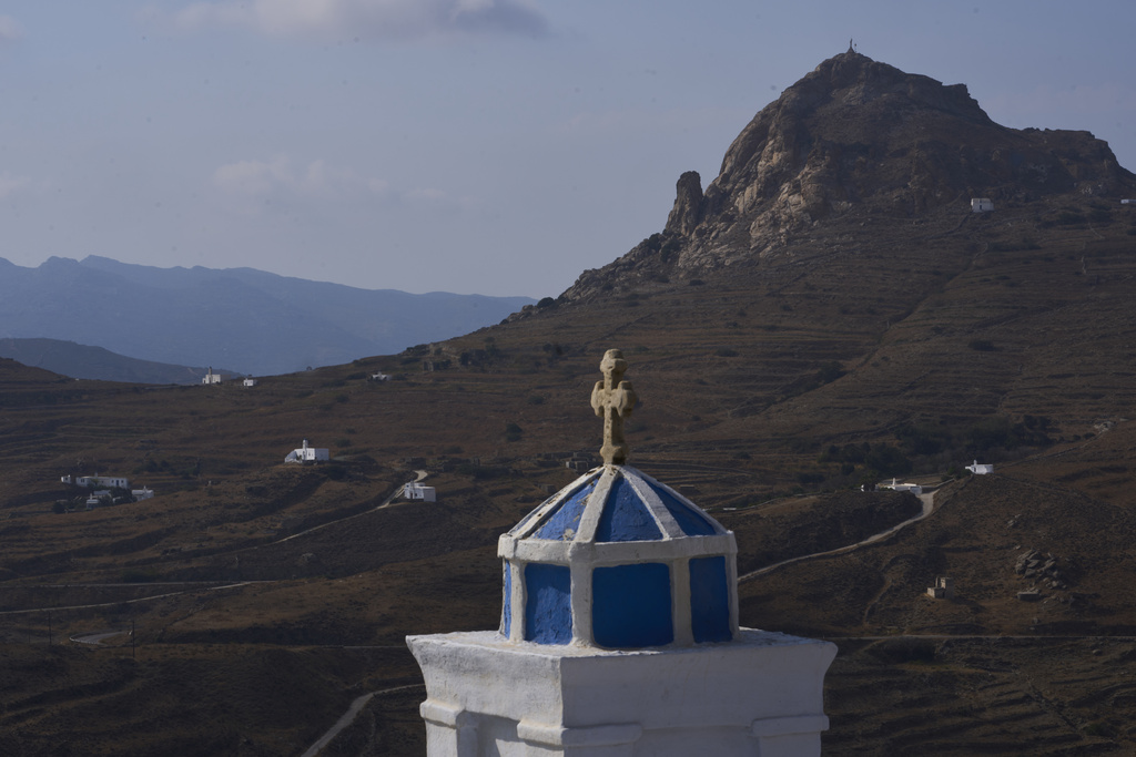 Family-owned chapels stand on the Aegean Sea island of Tinos, Greece, Sunday, Sept. 7, 2025. (AP Photo/Petros Giannakouris)