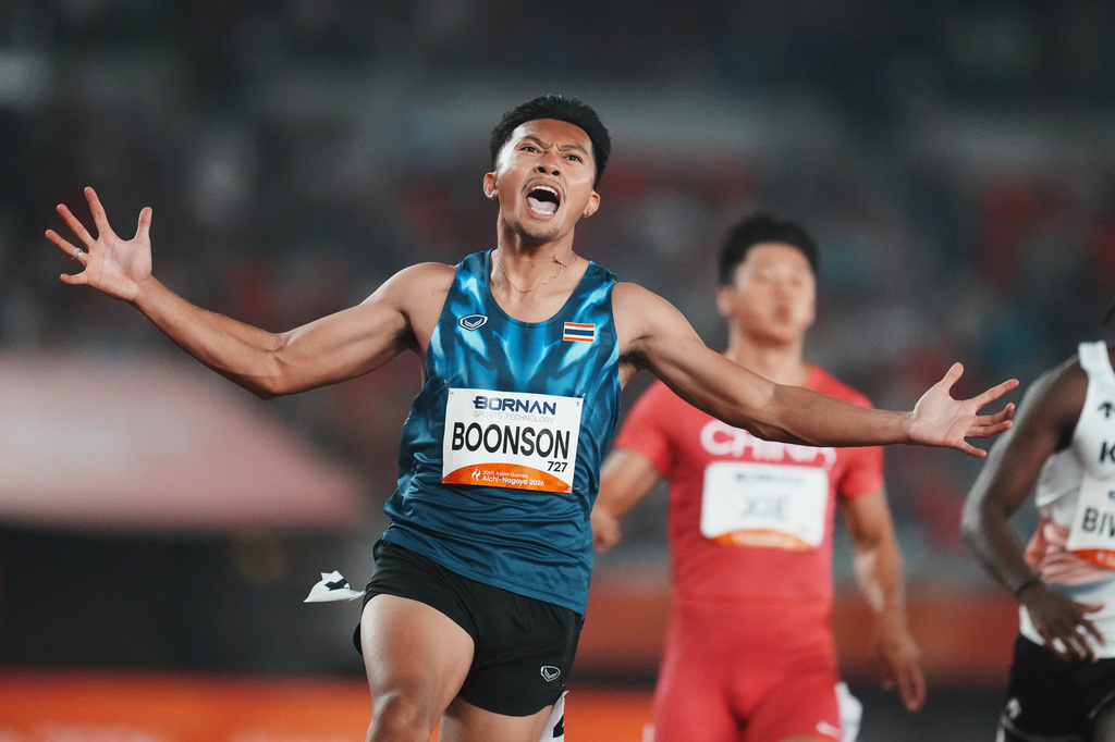 Thailand's Puripol Boonson celebrates after finishing first in the men's 100-meter final at the Asian Games in Nagoya, Japan, Friday, Sept. 25, 2026. (AP Photo/Lee Jin-man)