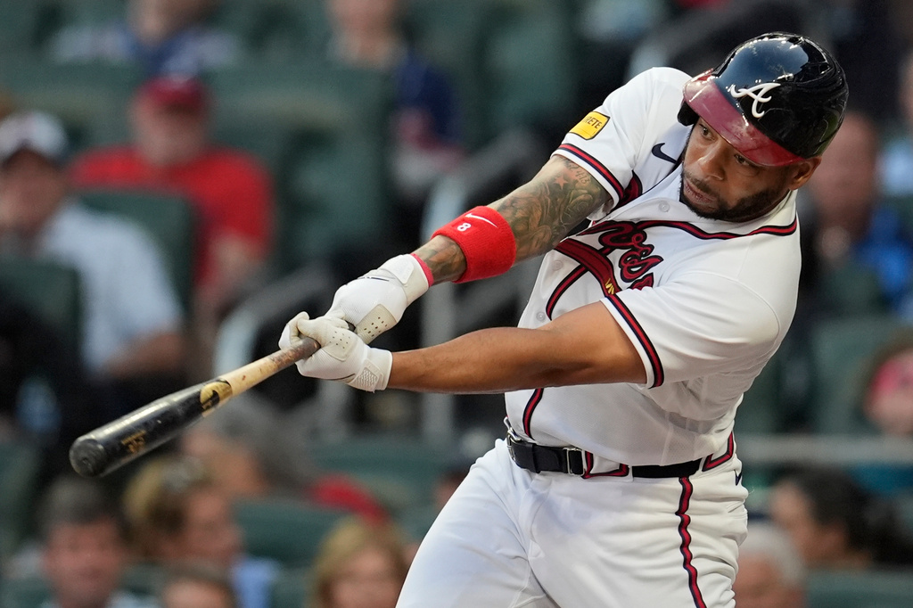 Atlanta Braves' Dominic Smith (8) hits a single in the third inning of a baseball game against the Chicago Cubs, Tuesday, May 12, 2026, in Atlanta. (AP Photo/Mike Stewart)
