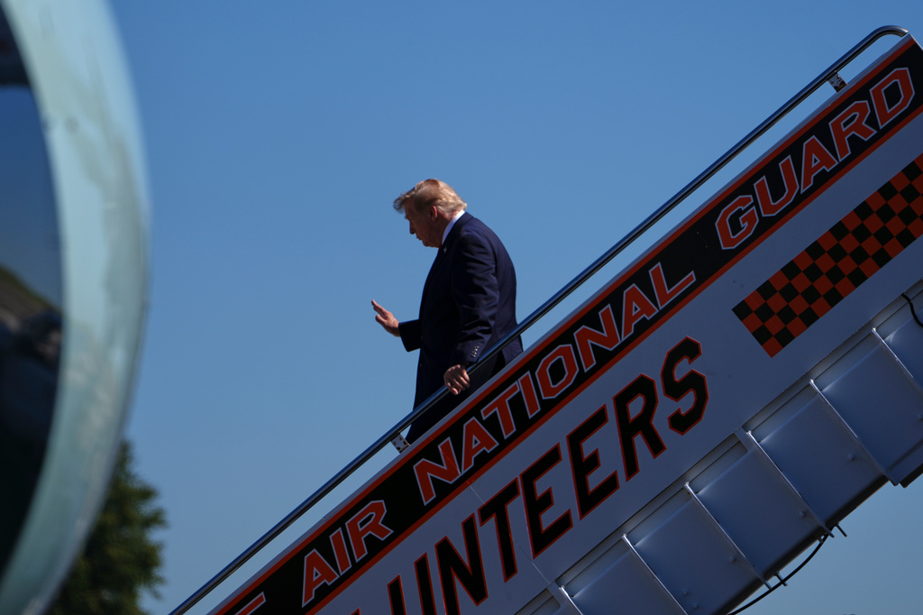 President Donald Trump disembarks Air Force one at McGhee Tyson Airport, Saturday, Sept. 26, 2026, in Alcoa, Tenn. (AP Photo/Julia Demaree Nikhinson)