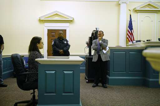 Commonwealth's Attorney Michael Newman listens as Blair Vogler testifies during a preliminary hearing for Shotsie Buck-Hayes in General District Court in Danville, Va., Tuesday, Sept. 30, 2025. Buck-Hayes is charged with setting her husband, City Councilman Lee Vogler, on fire in July. (AP Photo/Allen G. Breed) Commonwealth's Attorney Michael Newman listens as Blair Vogler testifies during a preliminary hearing for Shotsie Buck-Hayes in General District Court in Danville, Va., Tuesday, Sept. 30, 2025. Buck-Hayes is charged with setting her husband, City Councilman Lee Vogler, on fire in July. (AP Photo/Allen G. Breed)
