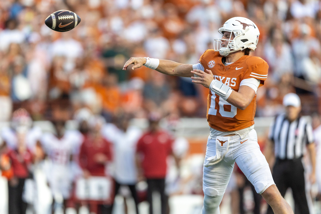 Texas quarterback Arch Manning (16) throws against Arkansas during the second half of an NCAA college football game Saturday, Nov. 22, 2025, in Austin, Texas. (AP Photo/Stephen Spillman)