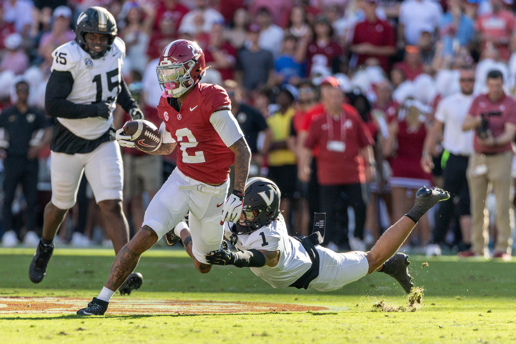 Alabama wide receiver Ryan Williams (2) runs after a catch past Vanderbilt safety Dontae Carter (1) during the first half of an NCAA college football game, Saturday, Oct. 4, 2025, in Tuscaloosa, Ala. (AP Photo/Vasha Hunt)