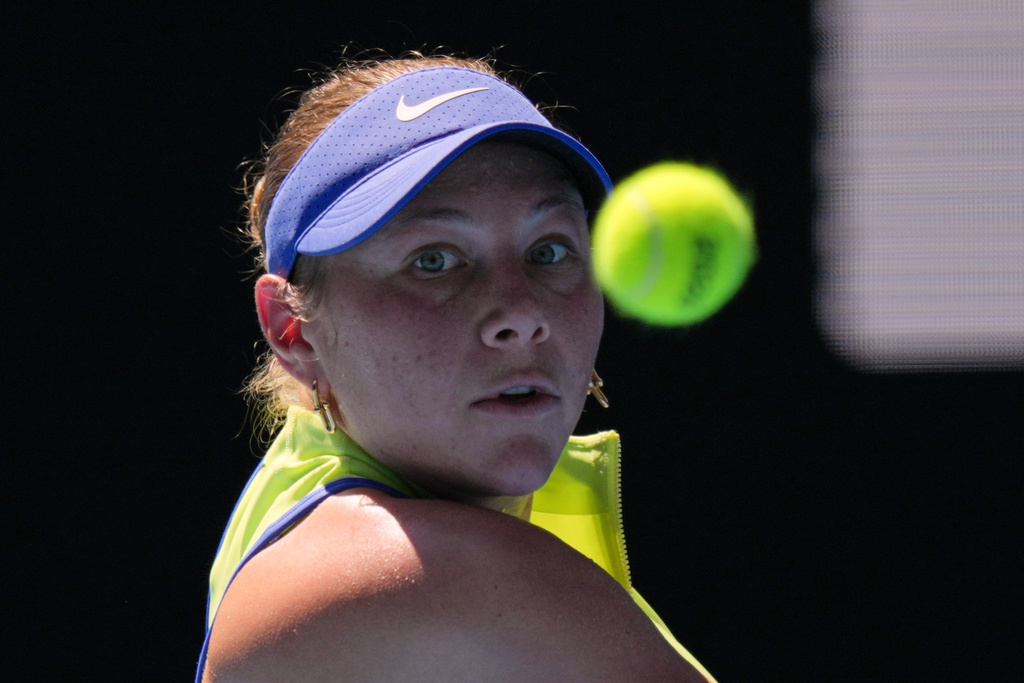 Amanda Anisimova of the U.S. plays a backhand return to Wang Xinyu of China during their fourth round match at the Australian Open tennis championship in Melbourne, Australia, Monday, Jan. 26, 2026. (AP Photo/Aaron Favila)