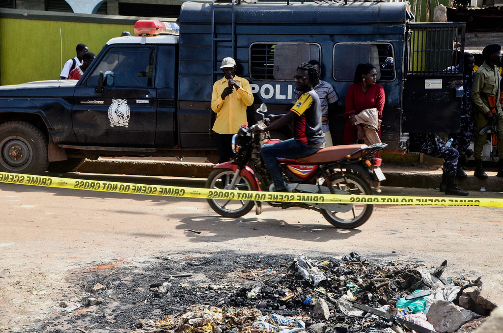 Uganda police officers at the crime scene after a man killed four children in a machete attack at the Gaba Early Childhood Development Program nursery school in Kampala, Uganda, Thursday, April 2, 2026. (AP Photo)