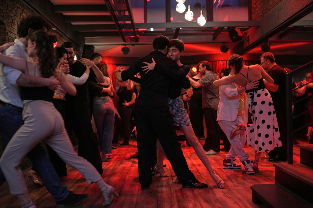 Tango enthusiasts dance during a milonga evening session at La Cumparsita in Istanbul, Turkey, Tuesday, Jan. 27, 2026. (AP Photo/Francisco Seco)