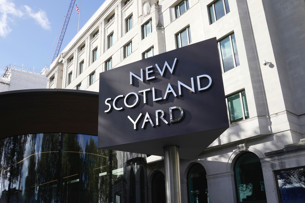 FILE - A sign stands in front of the New Scotland Yard, the headquarters of the London Metropolitan Police, in London, Sept. 25, 2023. (AP Photo/Kin Cheung, File)