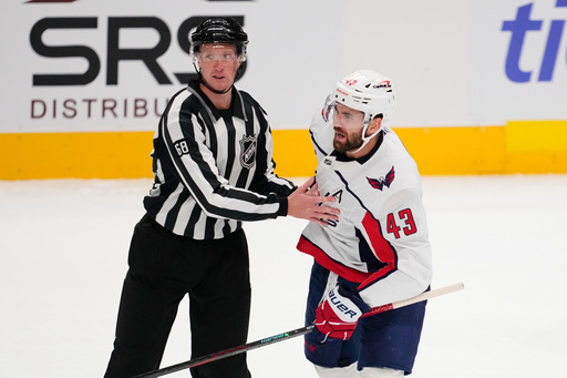 Washington Capitals' Tom Wilson (43) is escorted to the penalty box by linesman CJ Murray (68) in the first period of an NHL hockey game against the Dallas Stars Tuesday, Oct. 28, 2025, in Dallas. (AP Photo/Tony Gutierrez) Washington Capitals' Tom Wilson (43) is escorted to the penalty box by linesman CJ Murray (68) in the first period of an NHL hockey game against the Dallas Stars Tuesday, Oct. 28, 2025, in Dallas. (AP Photo/Tony Gutierrez)