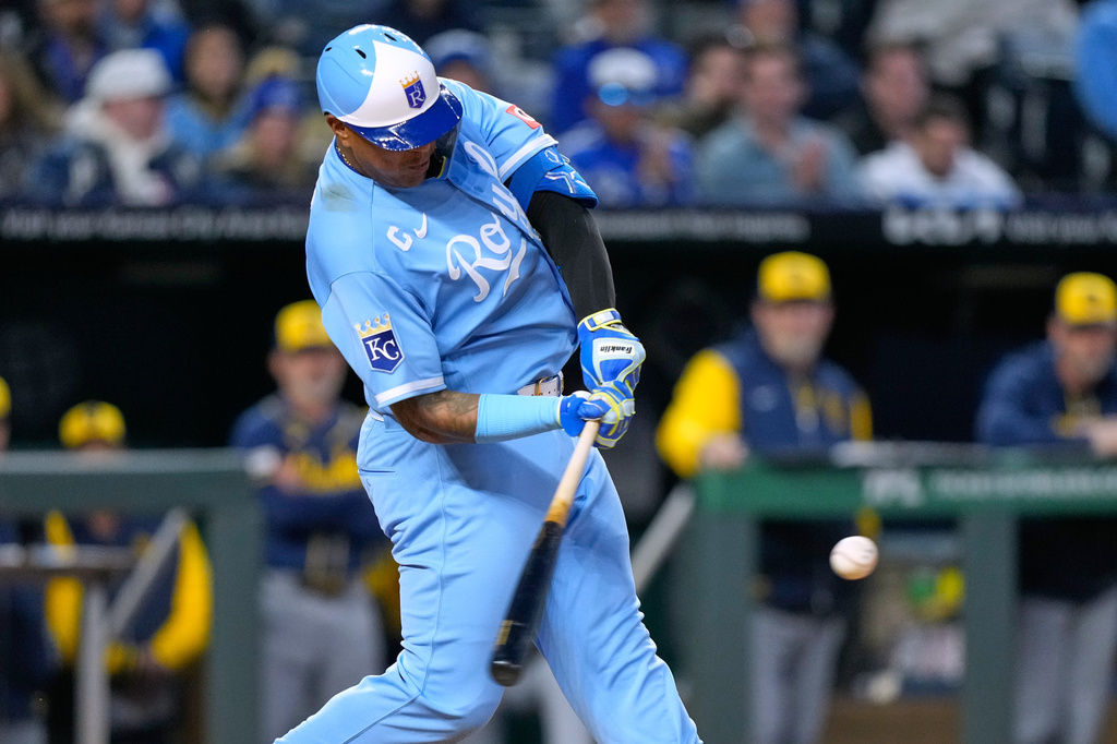 Kansas City Royals' Salvador Perez hits a solo home run during the sixth inning in the second baseball game of a doubleheader against the Milwaukee Brewers, Saturday, April 4, 2026, in Kansas City, Mo. (AP Photo/Charlie Riedel)