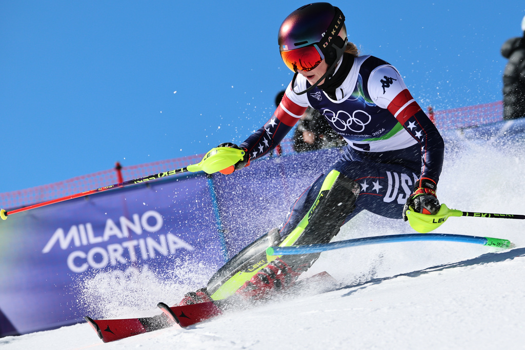 United States' Mikaela Shiffrin speeds down the course during an alpine ski, women's slalom race, at the 2026 Winter Olympics, in Cortina d'Ampezzo, Italy, Wednesday, Feb. 18, 2026. (AP Photo/Marco Trovati)
