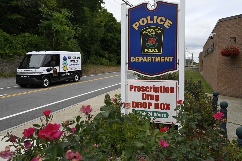 The Norwich Police ice cream patrol truck leaves the station on its way to delivery ice cream to summer campers in Norwich, Conn., on Thursday, Aug. 21, 2025. (AP Photo/Jessica Hill)