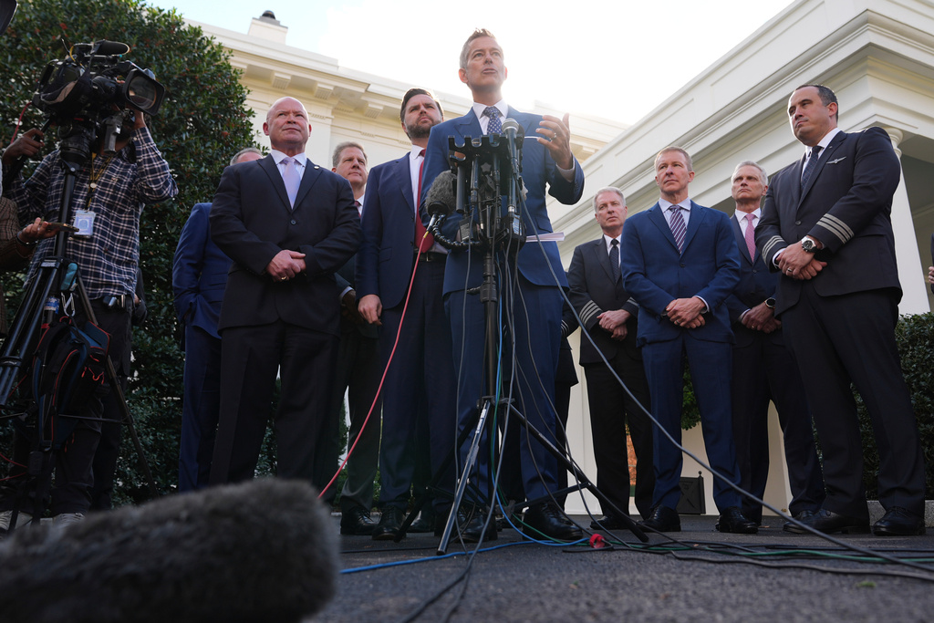 Transportation Secretary Sean Duffy speaks to the media alongside Sean O'Brien, President of the International Brotherhood of Teamsters, from left, Chris Sununu, president & CEO of Airlines for America, Vice President JD Vance and aviation industry representatives, about the impact of the government shutdown on the aviation industry, outside of the West Wing of the White House, Thursday, Oct. 30, 2025, in Washington. (AP Photo/Jacquelyn Martin)