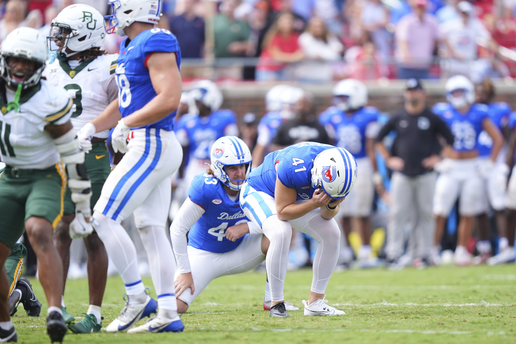 SMU place kicker Collin Rogers (41) reacts after missing a field goal with holder Wade McSparron (43) looking on during the second half of an NCAA college football game against Baylor, Saturday, Sept. 6, 2025, in Dallas. (AP Photo/LM Otero)