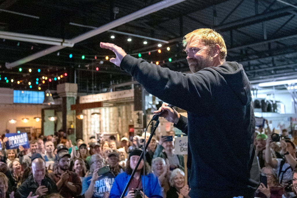 Senate candidate Graham Platner acknowledges the large crowd that attended Platner's town hall, Sept. 25, 2025, at Bunker Brewing in Portland, Maine. (Daryn Slover/Portland Press Herald via AP)