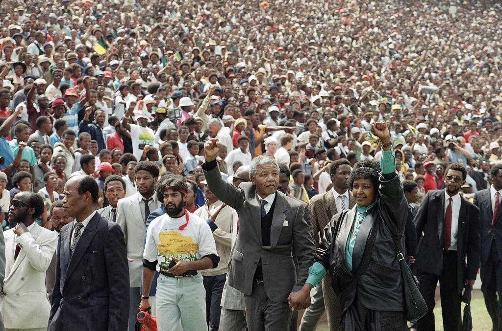 FILE - Nelson Mandela and Winnie Mandela give black power salutes as they enter Soccer City stadium Feb. 13, 1990, in the Soweto township of Johannesburg, South Africa, shortly after his release from 27 years in prison. (AP Photo/Udo Weitz, File)