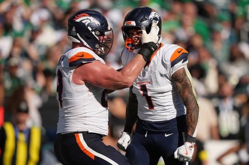 Denver Broncos tight end Evan Engram (1) celebrates his touchdown with Broncos offensive tackle Mike McGlinchey during the second half of an NFL football game against the Philadelphia Eagles on Sunday, Oct. 5, 2025, in Philadelphia. (AP Photo/Matt Slocum) Denver Broncos tight end Evan Engram (1) celebrates his touchdown with Broncos offensive tackle Mike McGlinchey during the second half of an NFL football game against the Philadelphia Eagles on Sunday, Oct. 5, 2025, in Philadelphia. (AP Photo/Matt Slocum)