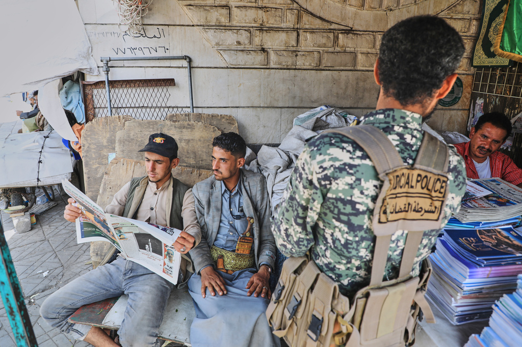 People read a newspaper to follow the war news at a shop in Sanaa, Yemen, Tuesday, Sept. 8, 2026. (AP Photo/Osamah Abdulrahman)