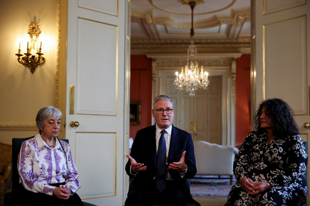 Britain's Prime Minister Keir Starmer, center, attends a meeting with campaigners to discuss historical forced adoption, at Downing Street, in London, Thursday July 2, 2026. (Isabel Infantes/Pool Photo via AP)
