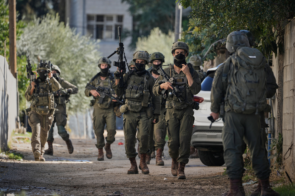 Israeli soldiers are seen during an army raid in the West Bank town of Tubas, Wednesday, Nov. 26, 2025. (AP Photo/Majdi Mohammed)