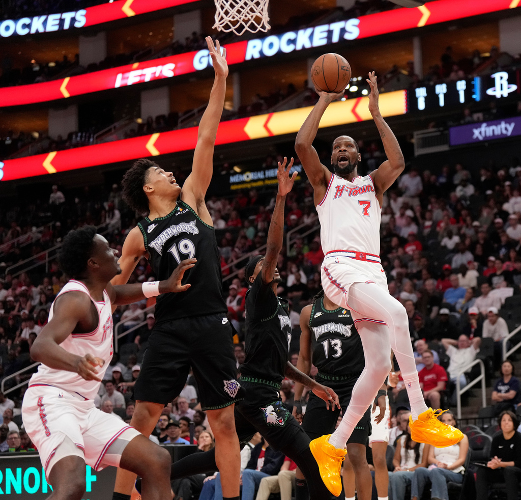 Houston Rockets forward Kevin Durant (7) goes up to the basket against Minnesota Timberwolves center Joan Beringer (19) during the first half of an NBA basketball game, Friday, April 10, 2026, in Houston. (AP Photo/ Karen Warren)