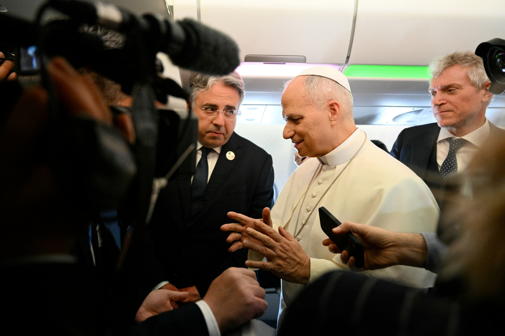 Pope Leo XIV speaks to journalists aboard his flight bound for Algiers’ Houari Boumédiène International Airport on Monday, April 13, 2026, at the start of an 11-day apostolic journey to Africa. (Alberto Pizzoli/Pool Photo via AP)