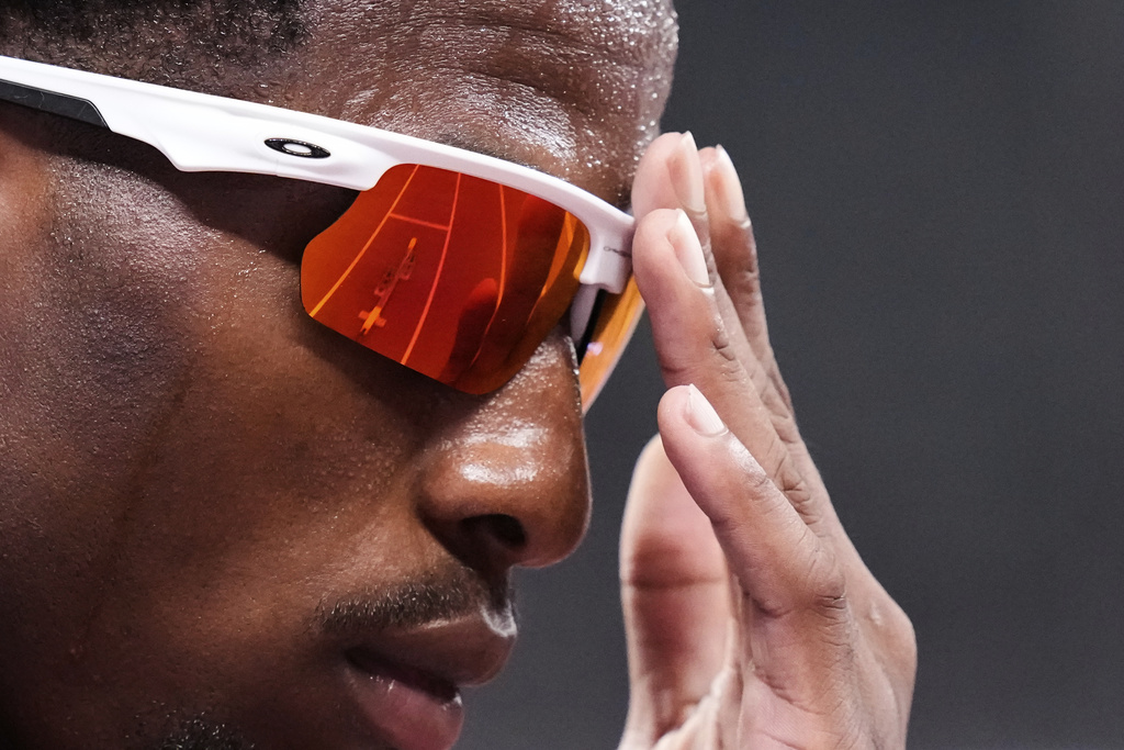 The track is reflected in the glasses of United States' Khaleb McRae as he prepares to compete in the men's 400 meters heat at the World Athletics Championships in Tokyo, Sunday, Sept. 14, 2025. (AP Photo/Eugene Hoshiko)