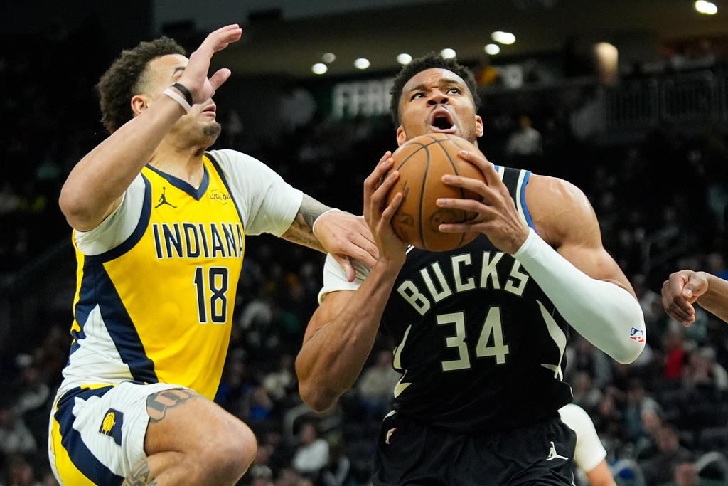 Milwaukee Bucks' Giannis Antetokounmpo (34) drives to the basket against Indiana Pacers' Jalen Slawson (18) during the second half of an NBA basketball game, Sunday, March 15, 2026, in Milwaukee. (AP Photo/Aaron Gash)