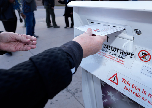 FILE - A voter places a ballot in a drop box outside the Denver Elections Division headquarters, Nov. 8, 2022, in downtown Denver. (AP Photo/David Zalubowski, File) FILE - A voter places a ballot in a drop box outside the Denver Elections Division headquarters, Nov. 8, 2022, in downtown Denver. (AP Photo/David Zalubowski, File)