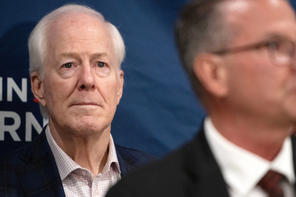 Sen. John Cornyn, R-Texas, listens to State Sen. Charles Perry, R-Lubbock, during a campaign event in Lubbock, Texas, Tuesday, May 19, 2026. (AP Photo/Annie Rice)