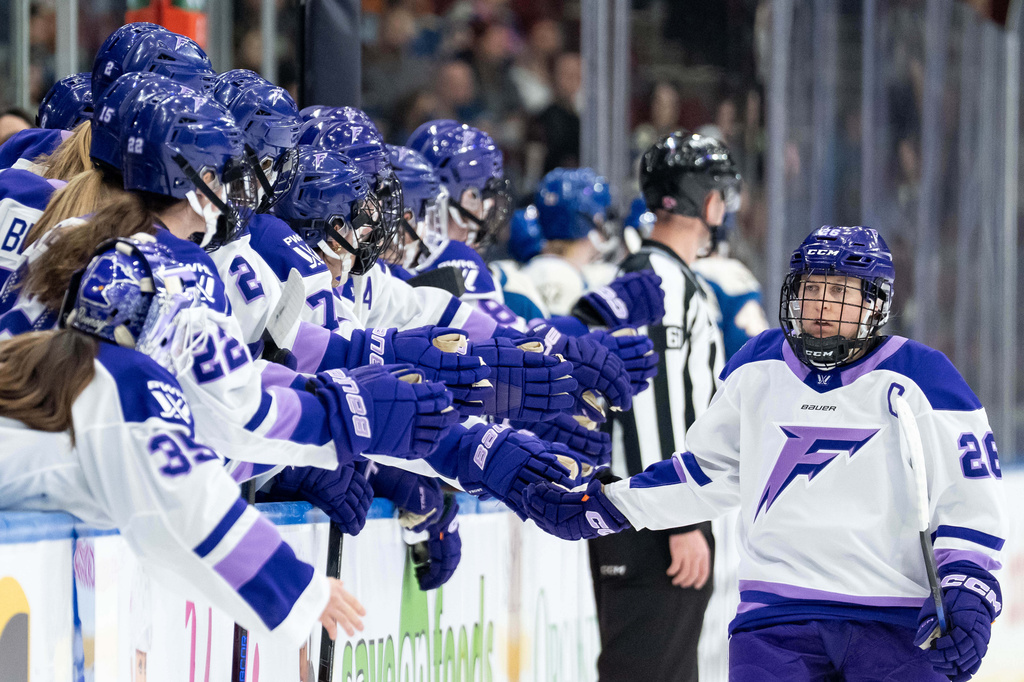 FILE - Minnesota Frost's Kendall Coyne Schofield, front right, celebrates with teammates after her goal against the Vancouver Goldeneyes during the first period of a PWHL hockey game in Vancouver, British Columbia, April 25, 2026. (Ethan Cairns/The Canadian Press via AP, File)