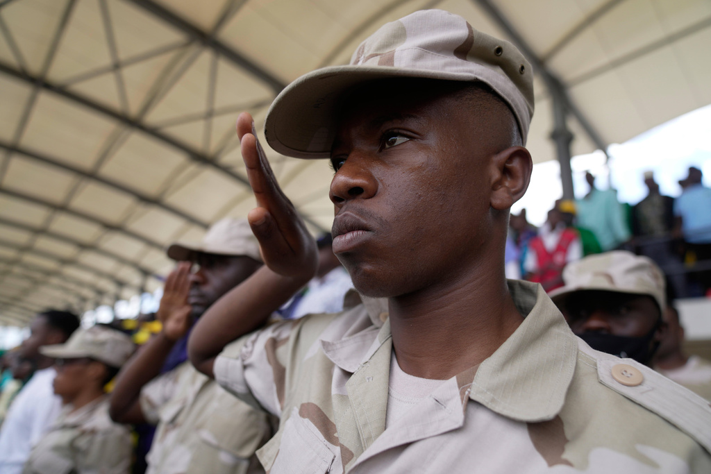 Tanzania security personnel salute as the national anthem is sung during the inauguration of Zanzibar President elect Hussein Ali Mwinyi of the ruling Chama Cha Mapinduzi (Revolutionary Party) at Amman Stadium in Zanzibar, Tanzania, Saturday, Nov. 1, 2025. (AP Photo/Brian Inganga)