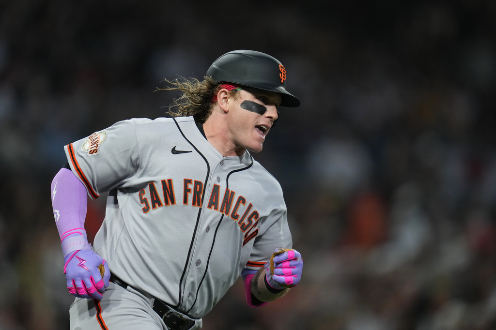 San Francisco Giants' Harrison Bader celebrates his home run during the third inning of a baseball game against the San Diego Padres Monday, March 30, 2026, in San Diego. (AP Photo/Gregory Bull)