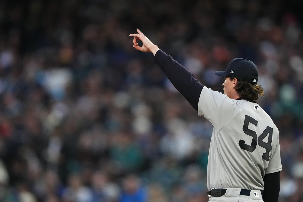 New York Yankees starting pitcher Max Fried reacts after a center fielder Trent Grisham caught a long line drive from Seattle Mariners' Randy Arozarena for an out during the second inning of a baseball game, Tuesday, March 31, 2026, in Seattle. (AP Photo/Lindsey Wasson)