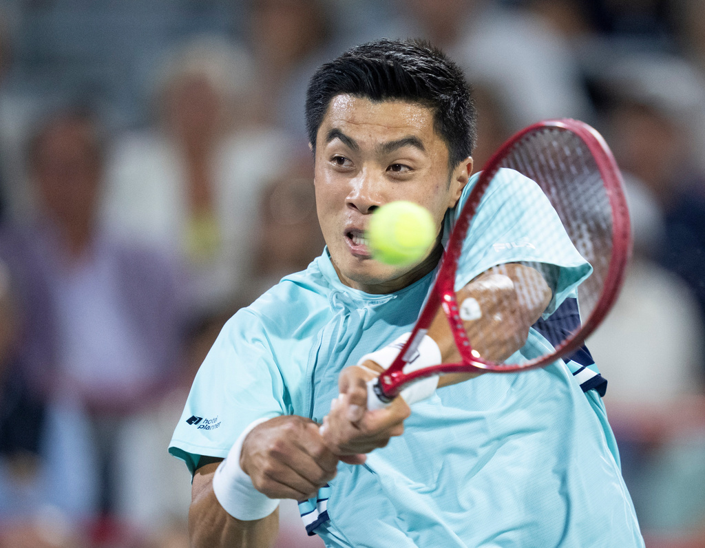 Brandon Nakashima of the United States hits a return to his compatriot Ben Shelton during final tennis match of the National Bank Open in Montreal, Thursday, Aug. 13, 2026. (Christinne Muschi/The Canadian Press via AP)