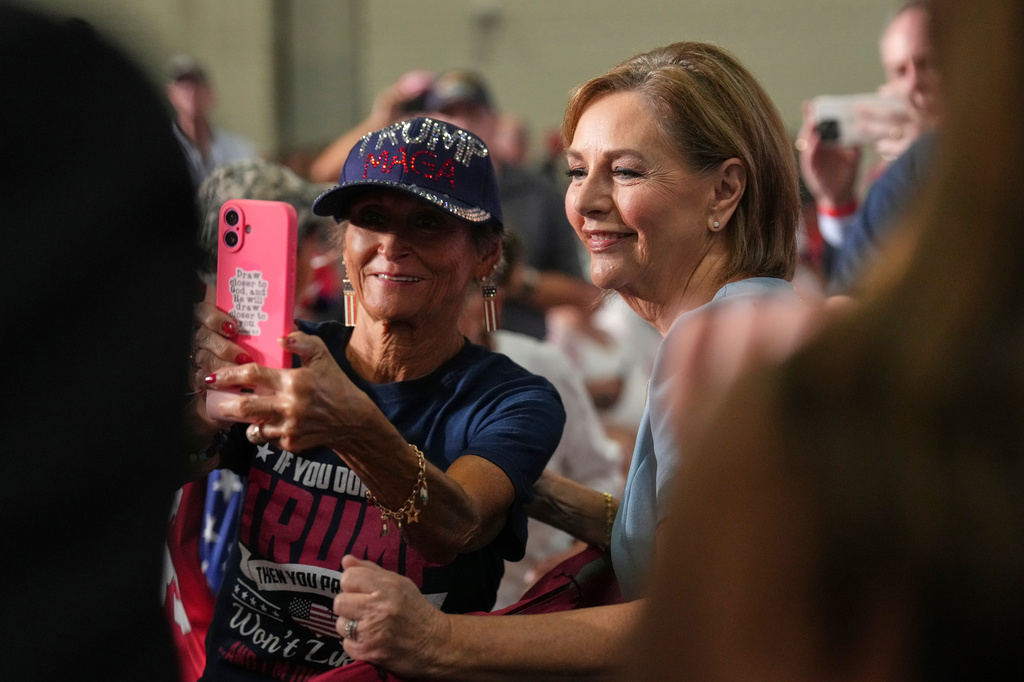 Sen. Darline Graham, R-S.C., takes a photo with an attendee during her campaign rally at the Myrtle Beach Convention Center in Myrtle Beach, S.C., Friday, Aug. 21, 2026. (AP Photo/Jacquelyn Martin)