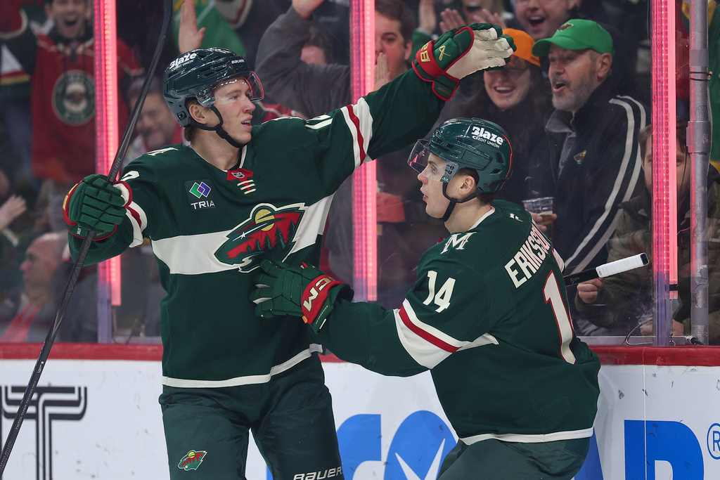 Minnesota Wild center Joel Eriksson Ek, right, celebrates his goal with left wing Matt Boldy (12) during the first period of an NHL hockey game against the Montréal Canadiens, Monday, Feb. 2, 2026, in St. Paul, Minn. (AP Photo/Matt Krohn)