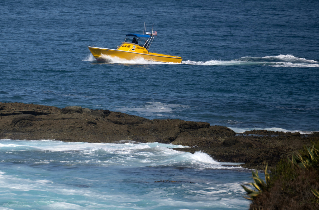 A lifeguard rescue boat cruises around the area where a child was swept out to sea near the Montage Resort on Wednesday, June 10, 2026, in Laguna Beach, Calif. (Mindy Schauer/The Orange County Register via AP)
