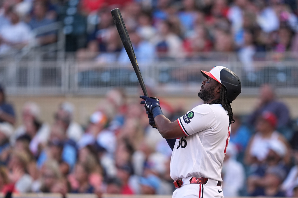 Minnesota Twins' Josh Bell watches his two-run home run during the first inning of a baseball game against the Atlanta Braves Tuesday, Aug. 18, 2026, in Minneapolis. (AP Photo/Abbie Parr)