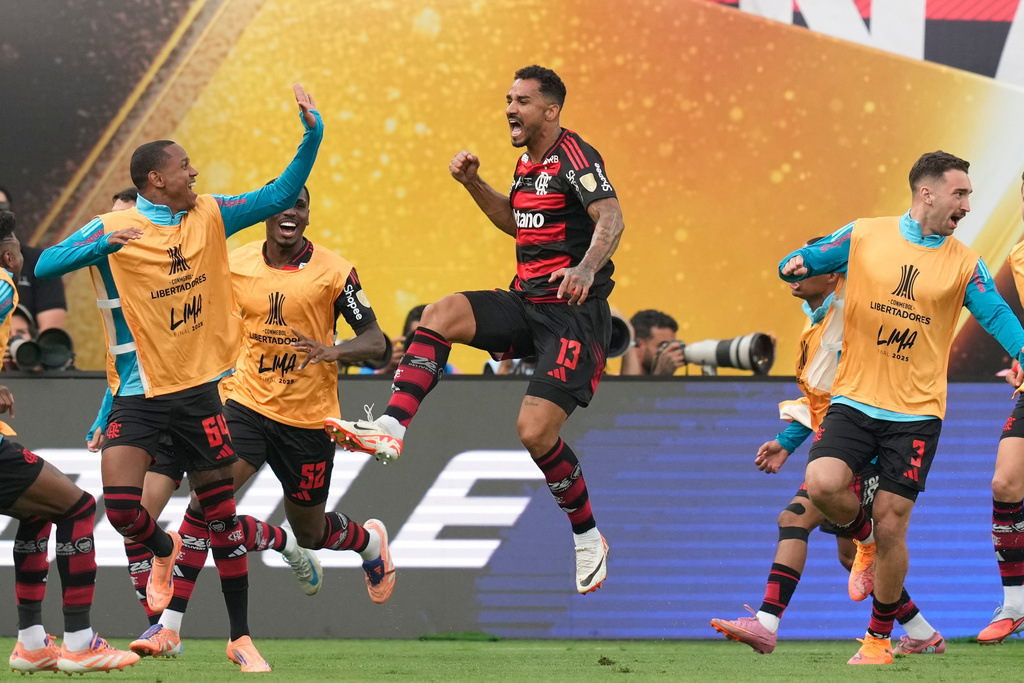Danilo of Brazil's Flamengo, center, celebrates after scoring his side's opening goal against Brazil's Palmeiras during a Copa Libertadores final soccer match in Lima, Peru, Saturday, Nov. 29, 2025. (AP Photo/Martin Mejia)