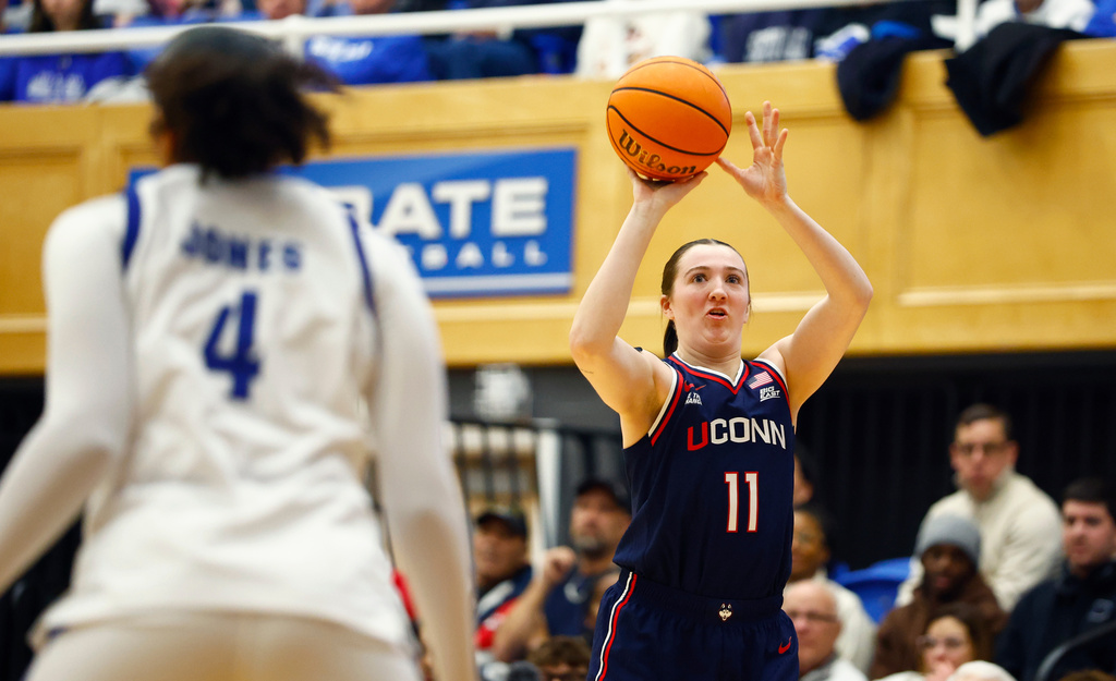 UConn guard Allie Ziebell (11) shoots against Seton Hall forward Savanna Jones (4) during the first half of an NCAA college basketball game, Saturday, Jan. 24, 2026, in South Orange, N.J. (AP Photo/Noah K. Murray)