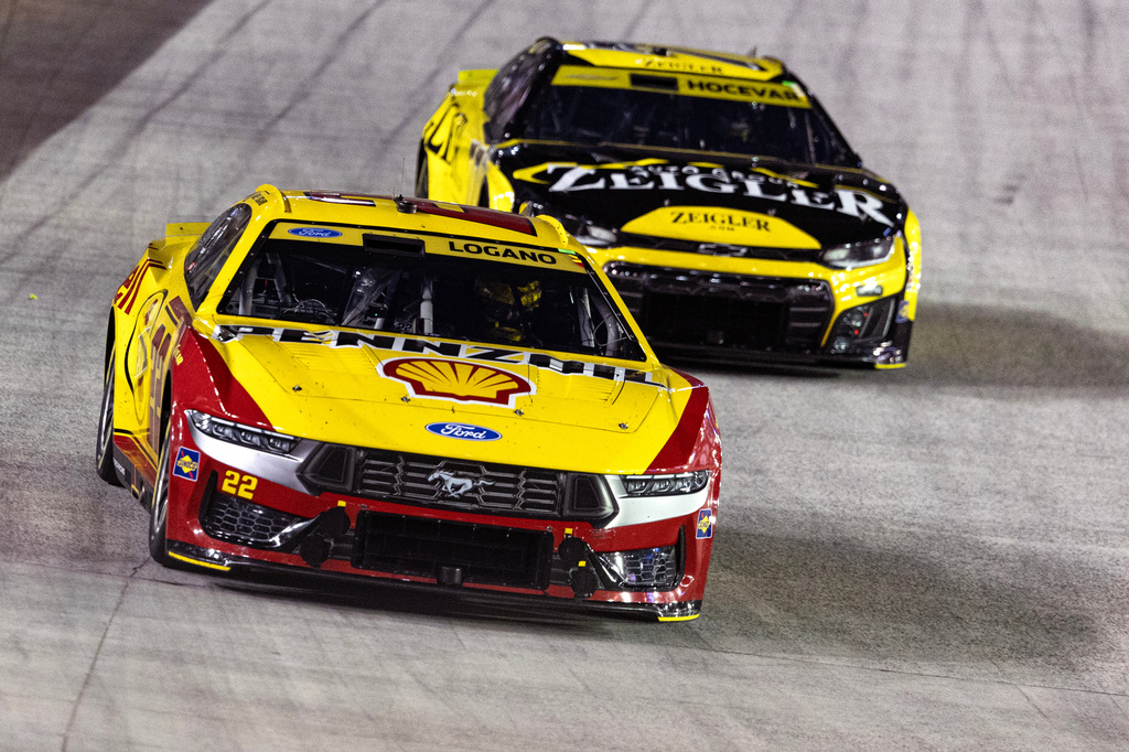 Joey Logano (22) leads Carson Hocevar, back, during a NASCAR Cup Series auto race Saturday, Sept. 19, 2026, in Bristol, Tenn. (AP Photo/Wade Payne)