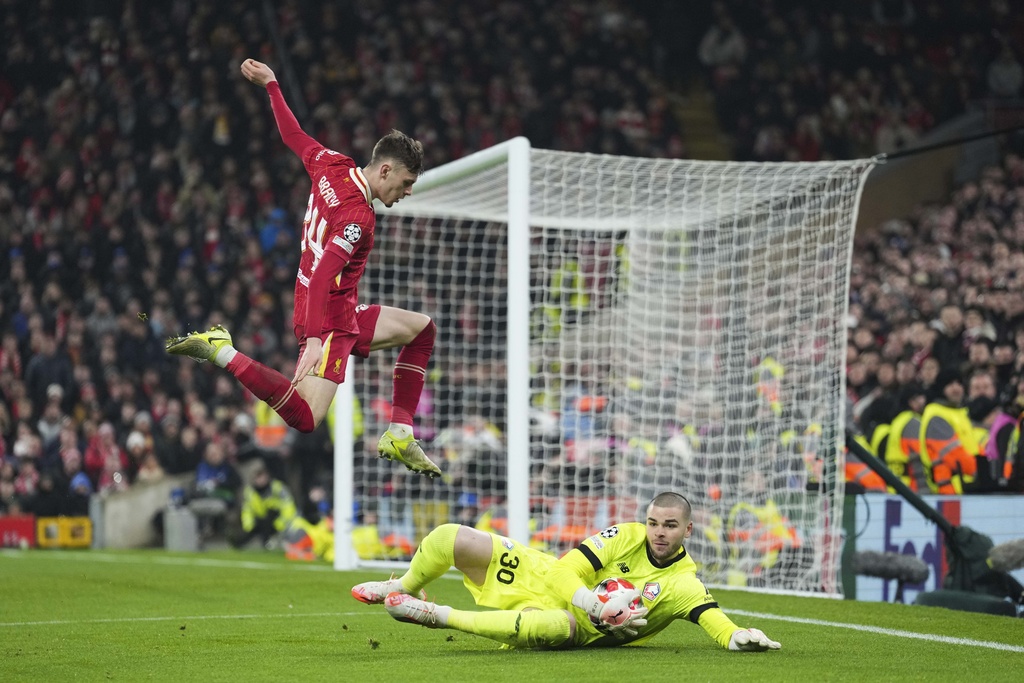 FILE - Lille's goalkeeper Lucas Chevalier saves on an attempt to score by Liverpool's Conor Bradley during the Champions League, opening phase soccer match at Anfield Stadium, in Liverpool, England, Jan.21, 2025. (AP Photo/Jon Super, File)