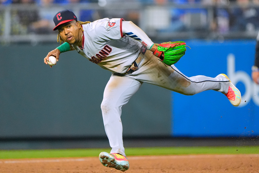 Cleveland Guardians third baseman Jose Ramirez looks to throw on after fielding a single hit by Kansas City Royals' Maikel Garcia during the fourth inning of a baseball game, Friday, Sept. 25, 2026, in Kansas City, Mo. (AP Photo/Charlie Riedel)