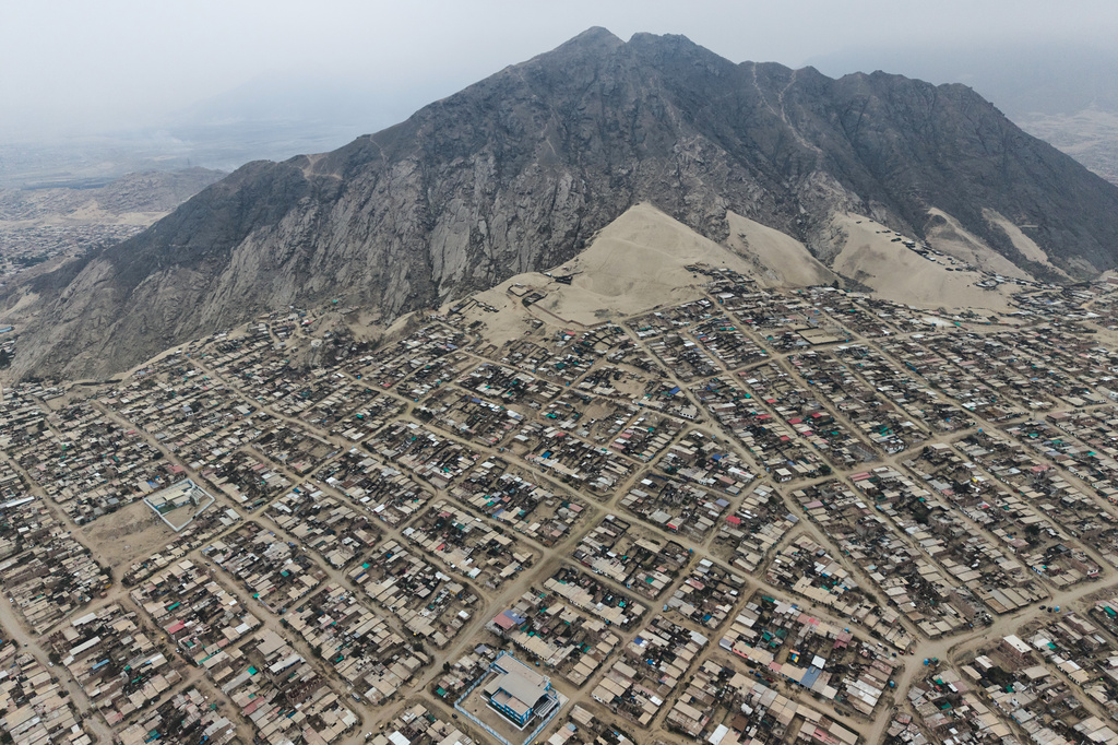 An aerial view of the La Esperanza district in Trujillo, Peru, Sunday, May 17, 2026. (AP Photo/Rodrigo Abd)