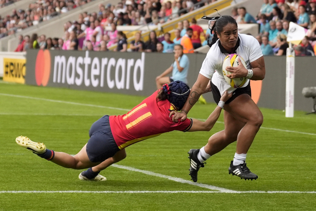 New Zealand's Ayesha Leti-I'iga breaks through and scores a try during the Women's Rugby World Cup 2025 Pool C match between New Zealand and Spain at York Community Stadium in York, England, Sunday, Aug. 24, 2025. (Danny Lawson/PA via AP)