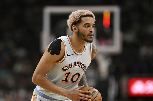 FILE - San Antonio Spurs' Jeremy Sochan runs up court during an NBA basketball game against the Boston Celtics, March 29, 2025, in San Antonio. (AP Photo/Darren Abate, File) FILE - San Antonio Spurs' Jeremy Sochan runs up court during an NBA basketball game against the Boston Celtics, March 29, 2025, in San Antonio. (AP Photo/Darren Abate, File)