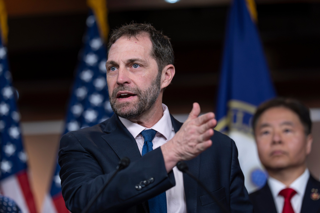 Rep. Jason Crow, D-Colo., a combat veteran, joins the House Democratic leadership in demanding a congressional approval for embarking on a war with Iran, during a news conference at the Capitol in Washington, Wednesday, March 4, 2026. (AP Photo/J. Scott Applewhite)