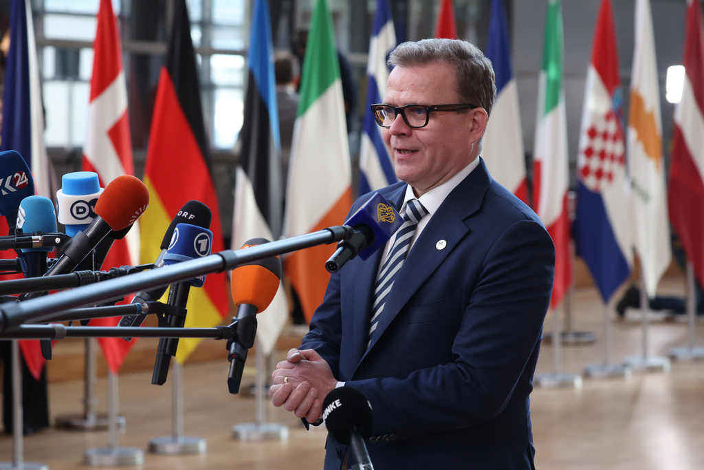 Finland's Prime Minister Petteri Orpo speaks with the media as he arrives for the EU summit at the European Council building in Brussels, Thursday, March 19, 2026. (AP Photo/Omar Havana)