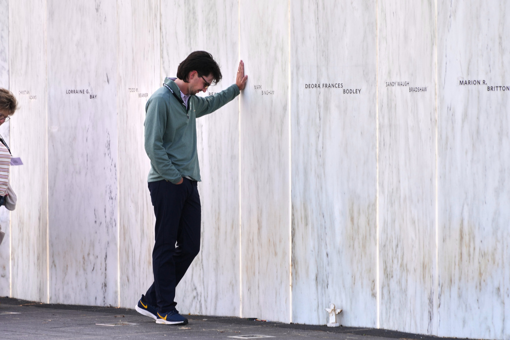 Social Studies teacher John Boston Bradley, who teaches at Bishop McCort High School in Johnstown, Pa., pauses at the Wall of Names during an educators seminar at the Flight 93 National Memorial in Shanksville, Pa., Tuesday, June 23, 2026. (AP Photo/Gene J. Puskar)