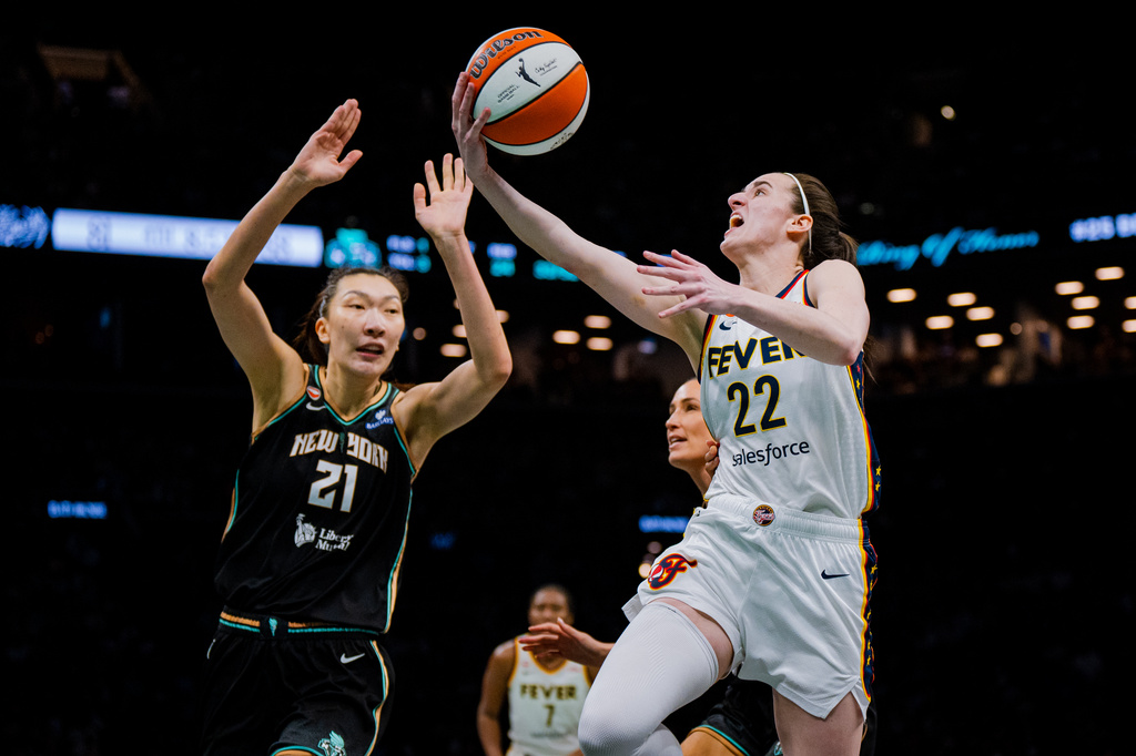 Indiana Fever guard Caitlin Clark (22) shoots a two-pointer during the second half of a WNBA basketball game against the New York Liberty, Saturday, Aug. 22, 2026, in New York. (AP Photo/Angelina Katsanis)